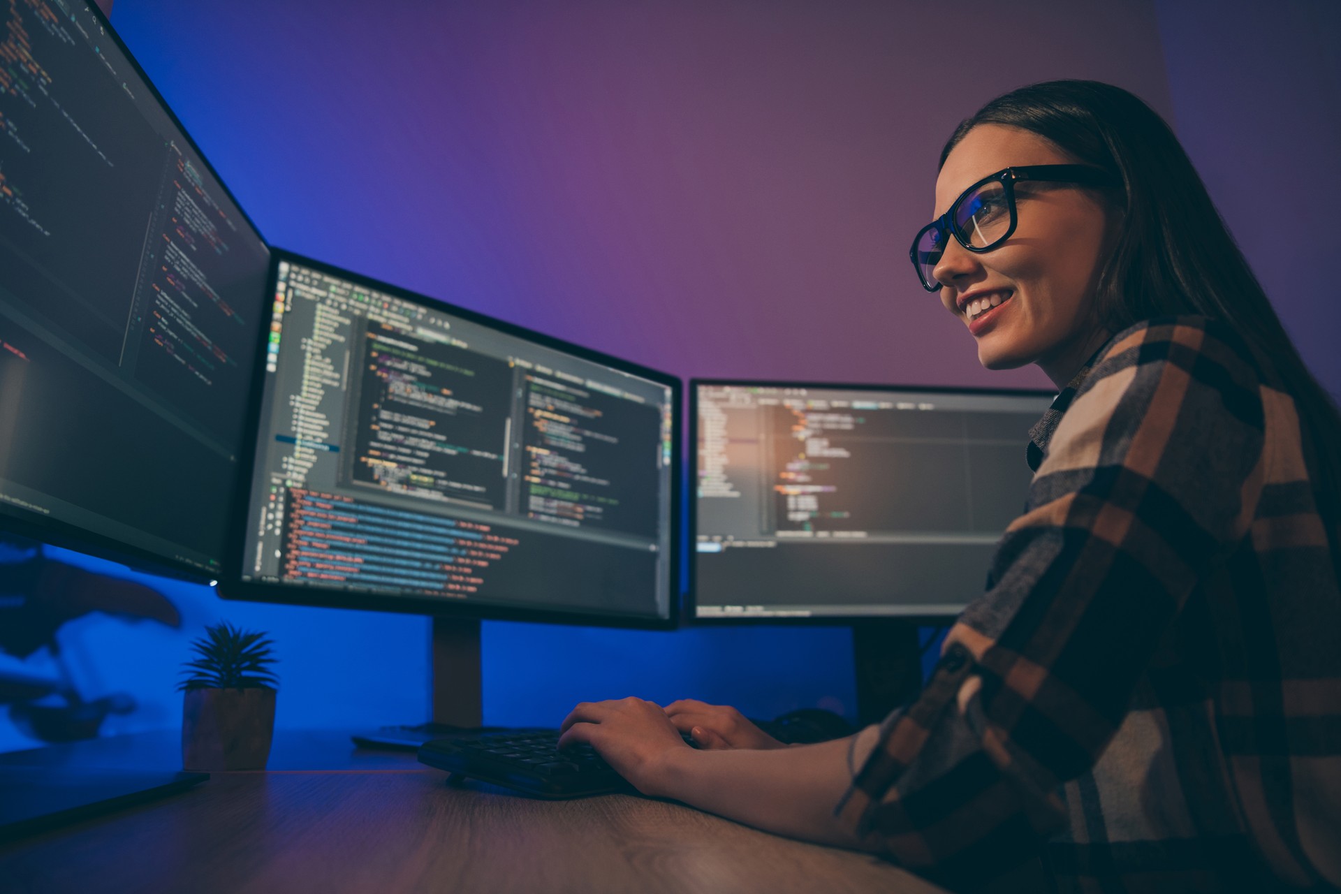 Low below angle view photo of cheerful woman finishing developing computer game solving all the current problems